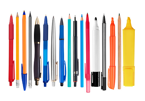 Pens and pencils on white background
